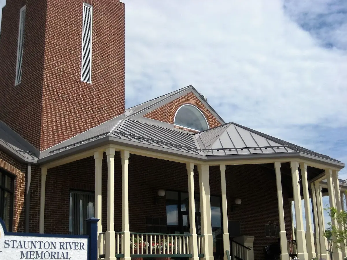 Skilled roofing craftsmen working on a residential roof in Gastonia